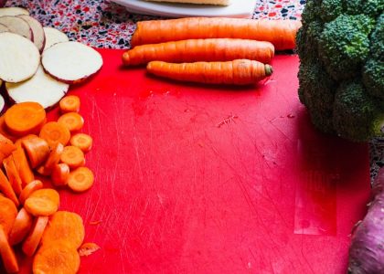 sliced carrots on red board